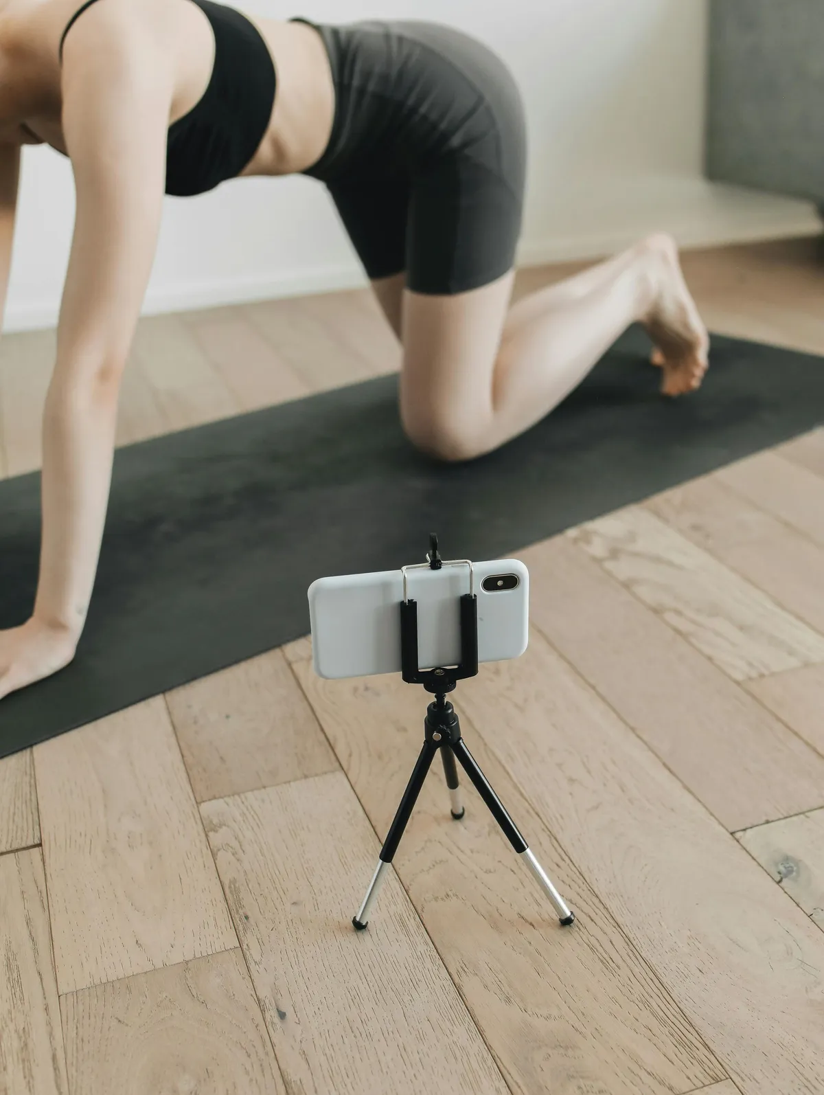 Personal trainer working with client on customized fitness program