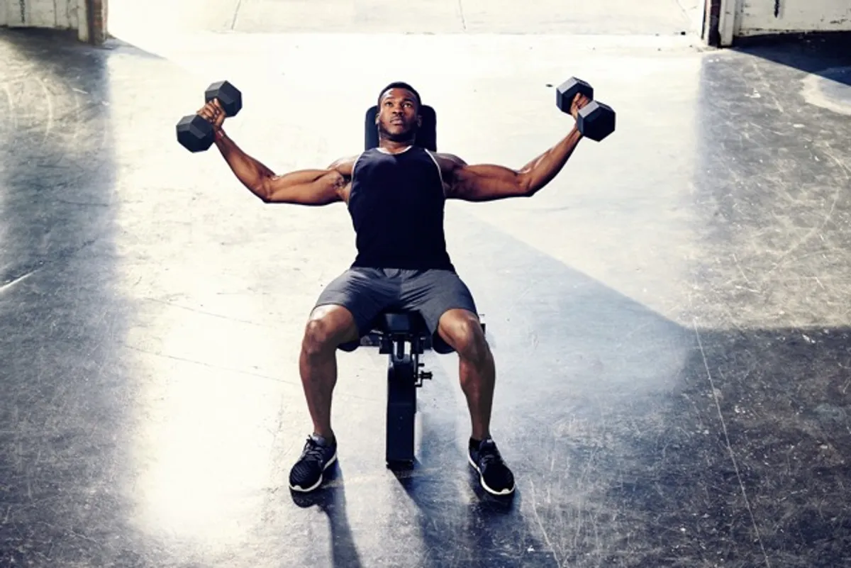 Personal trainer celebrating client success in gym