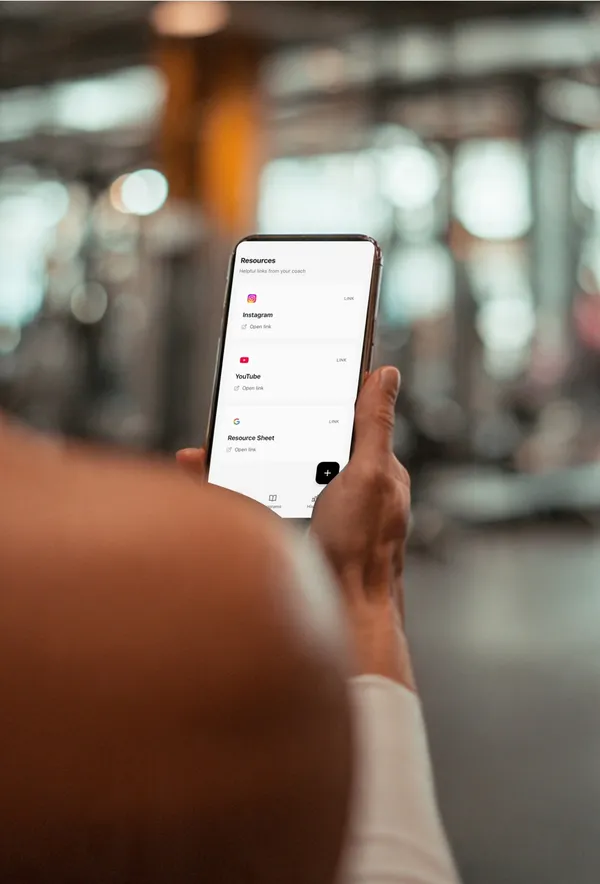 Resource links interface showing shared articles and videos for fitness coaching clients